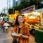 Enjoying street food at a Bangkok night market