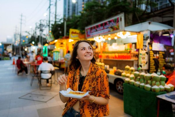 Enjoying street food at a Bangkok night market